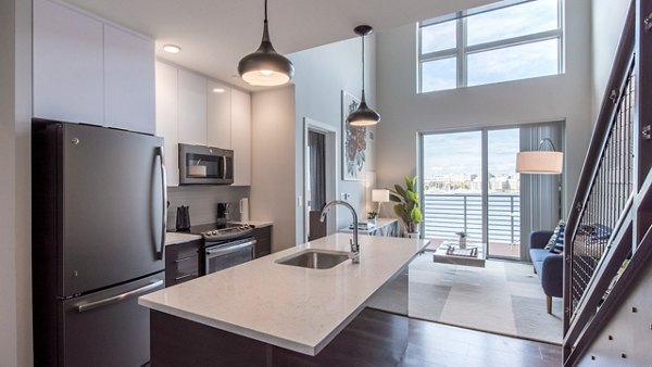Modern kitchen with stainless steel appliances at Boston East Apartments