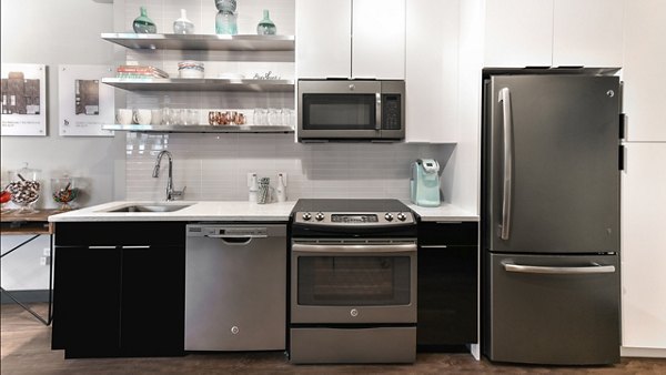 Modern kitchen with stainless steel appliances at Boston East Apartments