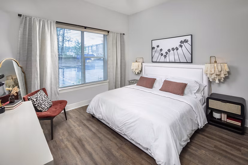 Cozy bedroom with modern decor in Broadstone Trailside Apartments, perfect for relaxation and luxury living