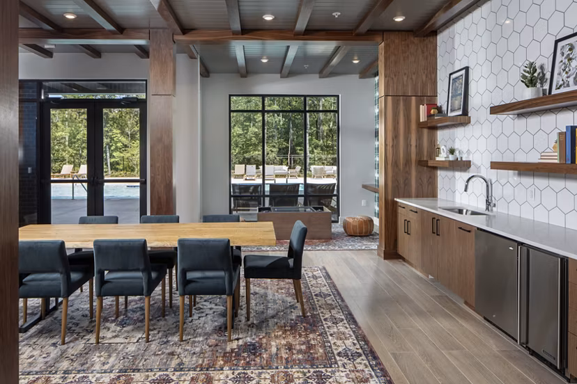 Clubhouse with modern amenities at Broadstone Trailside Apartments featuring spacious seating and entertainment areas