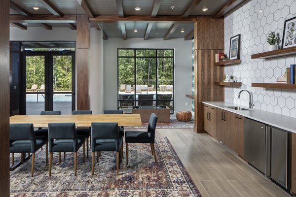 Clubhouse with modern amenities at Broadstone Trailside Apartments featuring spacious seating and entertainment areas