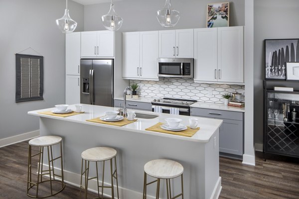 Modern kitchen with stainless steel appliances at Broadstone Trailside Apartments