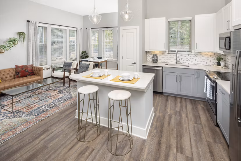 Modern kitchen with stainless steel appliances and granite countertops in Broadstone Trailside Apartments