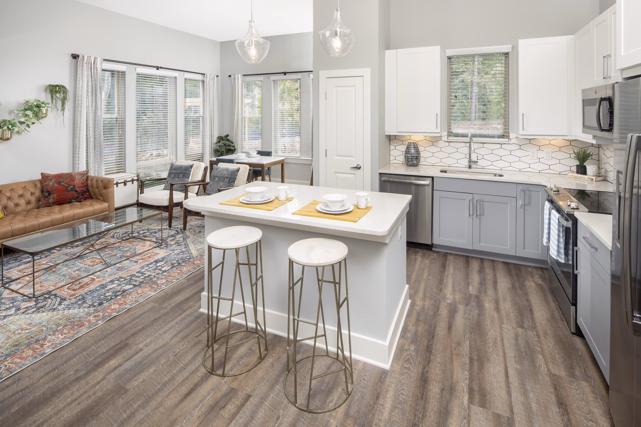 Modern kitchen with stainless steel appliances and granite countertops in Broadstone Trailside Apartments
