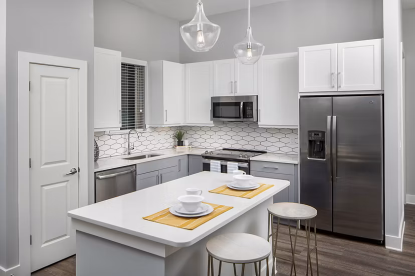 Modern kitchen featuring stainless steel appliances and granite countertops at Broadstone Trailside Apartments luxury complex