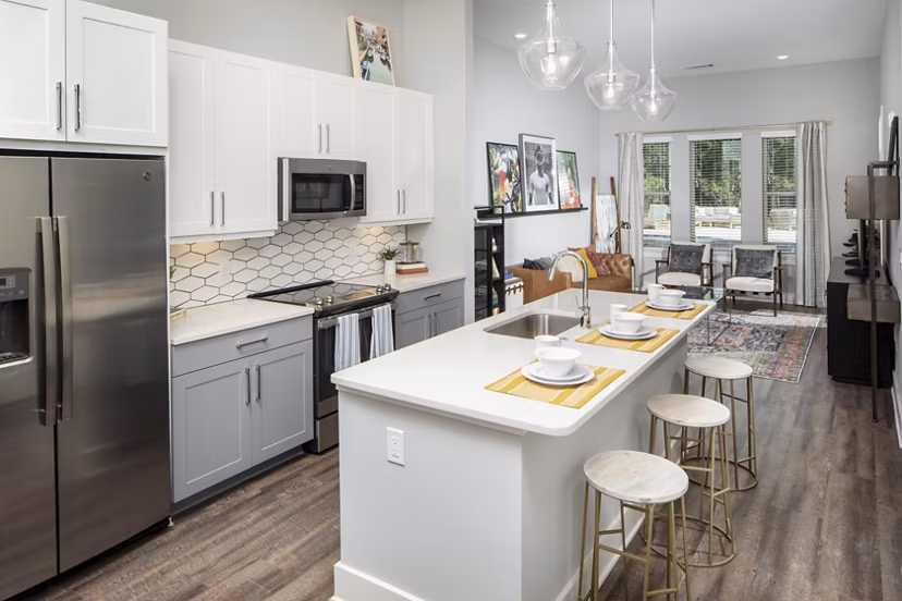 Modern kitchen with stainless steel appliances in Broadstone Trailside Apartments
