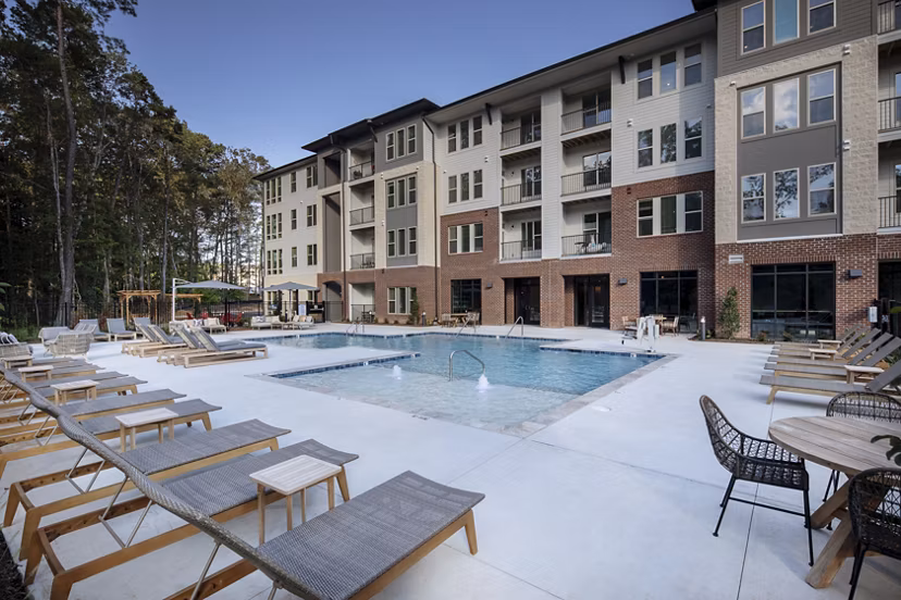 Rooftop pool with lounge chairs at Broadstone Trailside Apartments