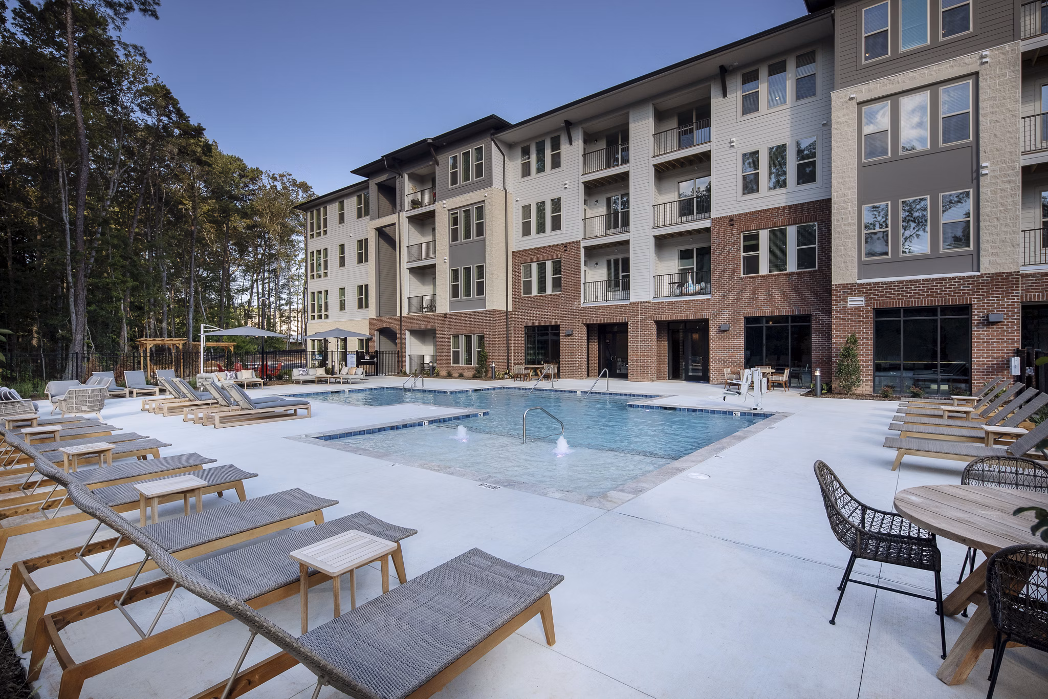 Rooftop pool with lounge chairs at Broadstone Trailside Apartments