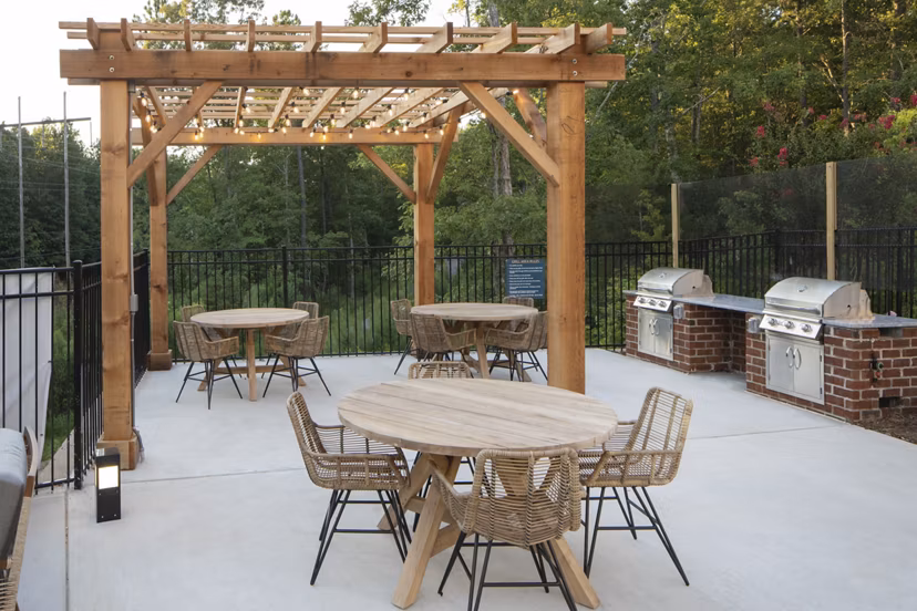 Outdoor grill area with modern seating at Broadstone Trailside Apartments