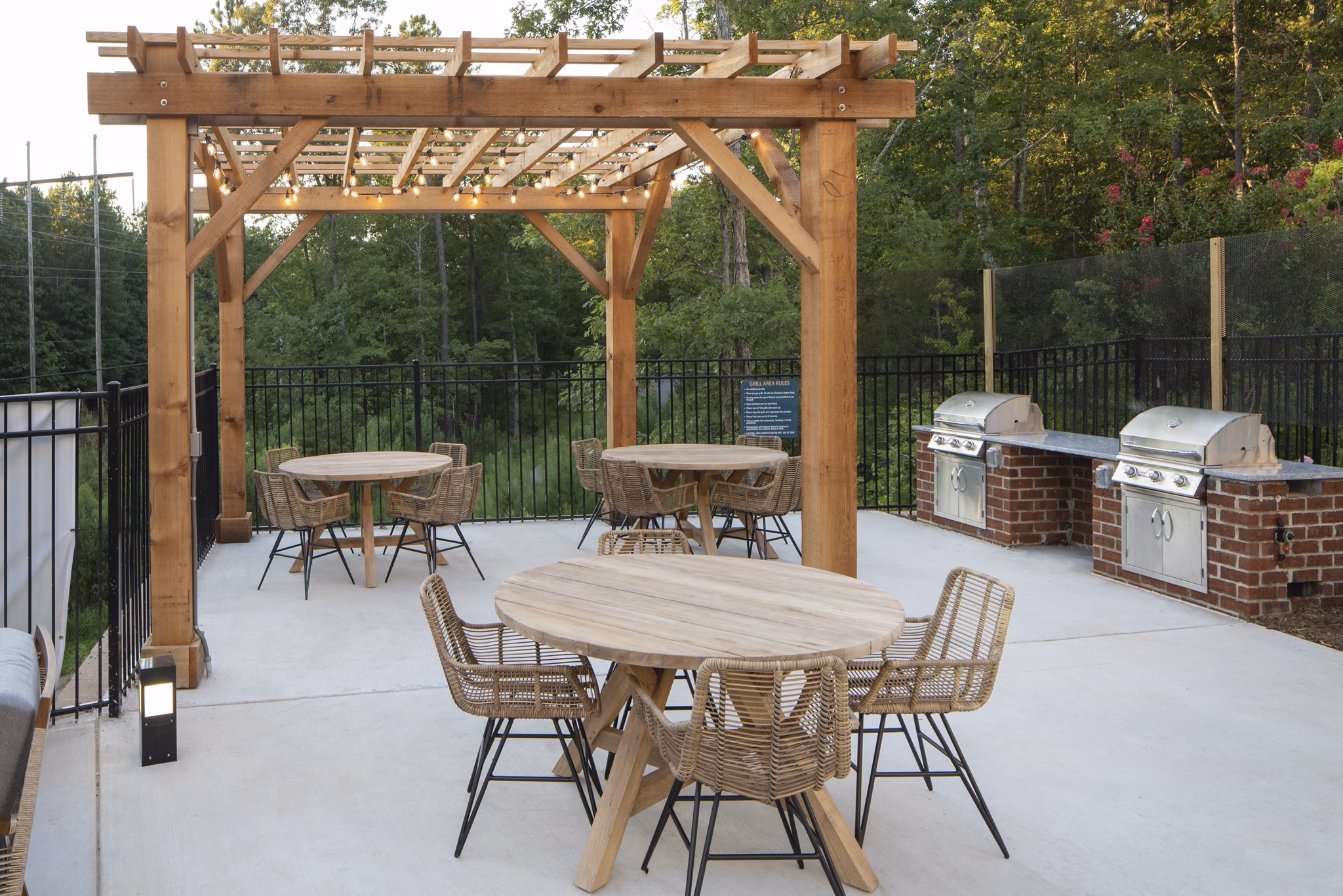 Outdoor grill area with modern seating at Broadstone Trailside Apartments