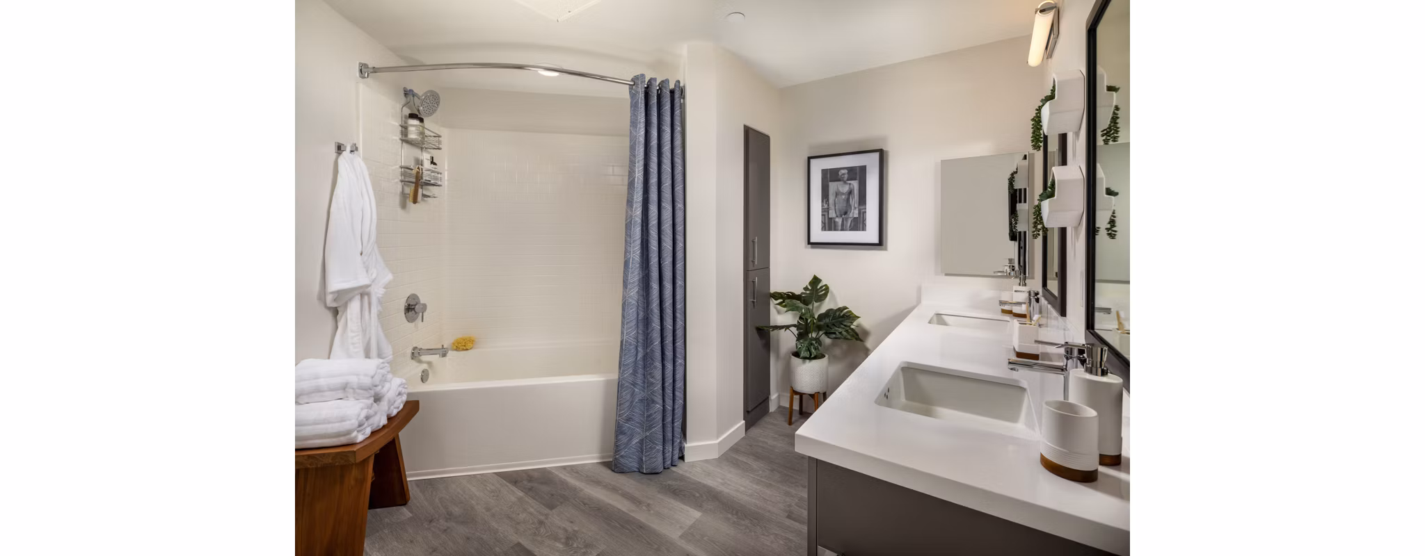 Bathroom featuring sleek countertops and modern fixtures in Garrison Apartments luxury community