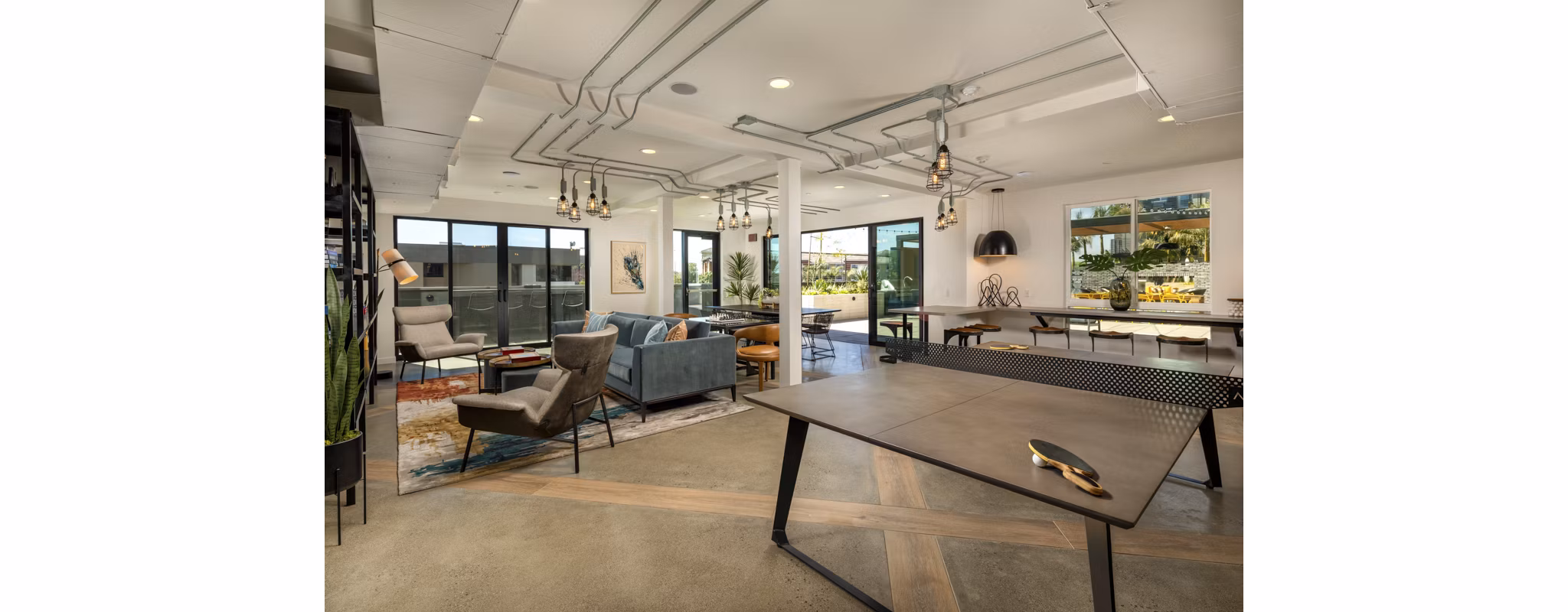 Clubhouse offering cozy seating and modern design at Garrison Apartments