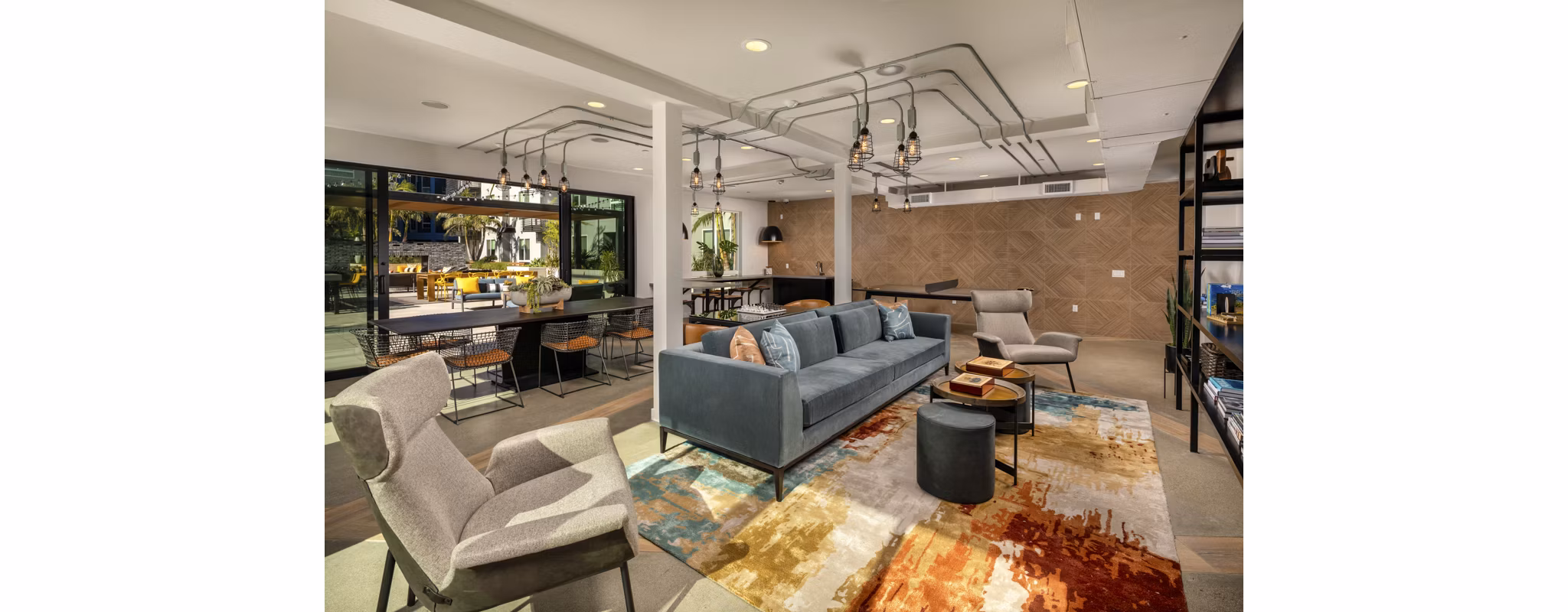 Clubhouse at Garrison Apartments: Elegant community space with contemporary design and cozy seating for residents to enjoy leisure and gatherings