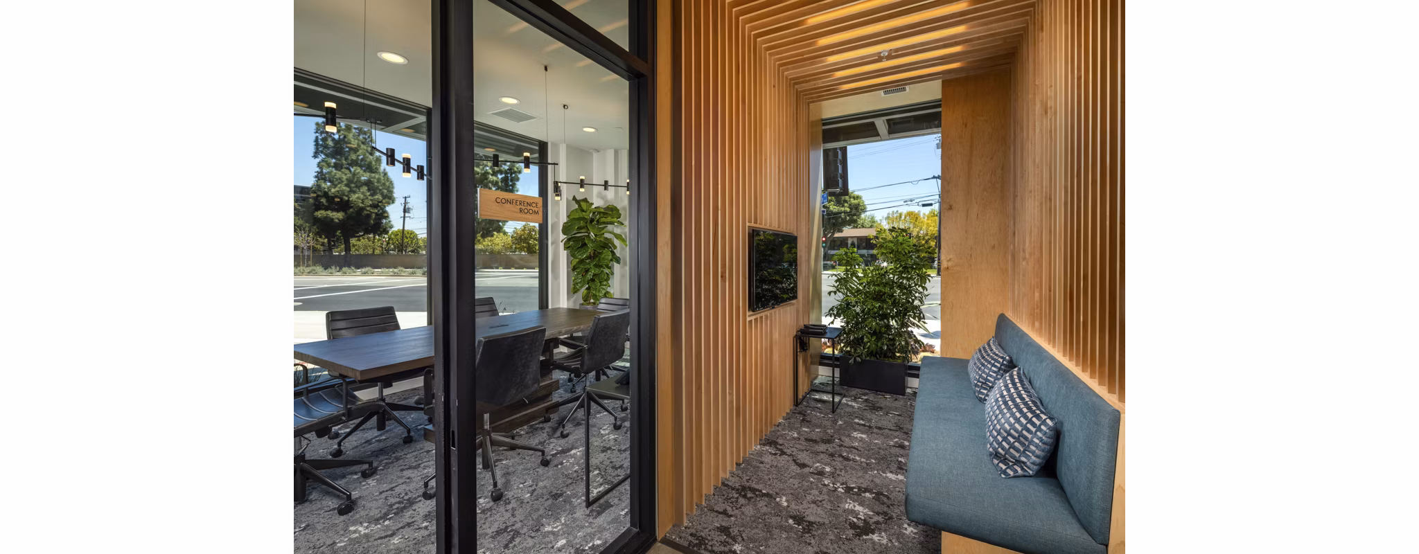 Clubhouse with modern design and cozy seating at Garrison Apartments, offering a welcoming space for residents