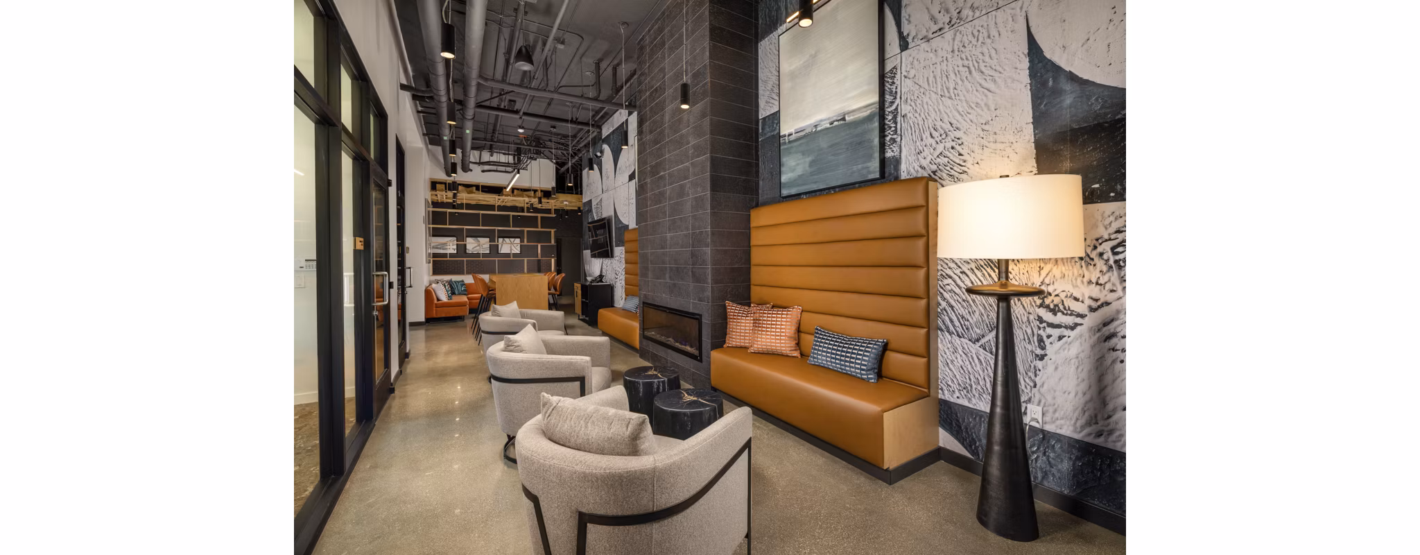 Clubhouse featuring modern design and cozy seating at Garrison Apartments