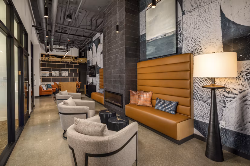 Clubhouse featuring modern design and cozy seating at Garrison Apartments