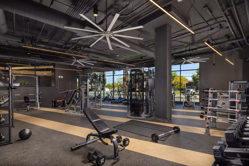 Fitness center featuring modern exercise equipment at Garrison Apartments, offering residents a comprehensive workout experience