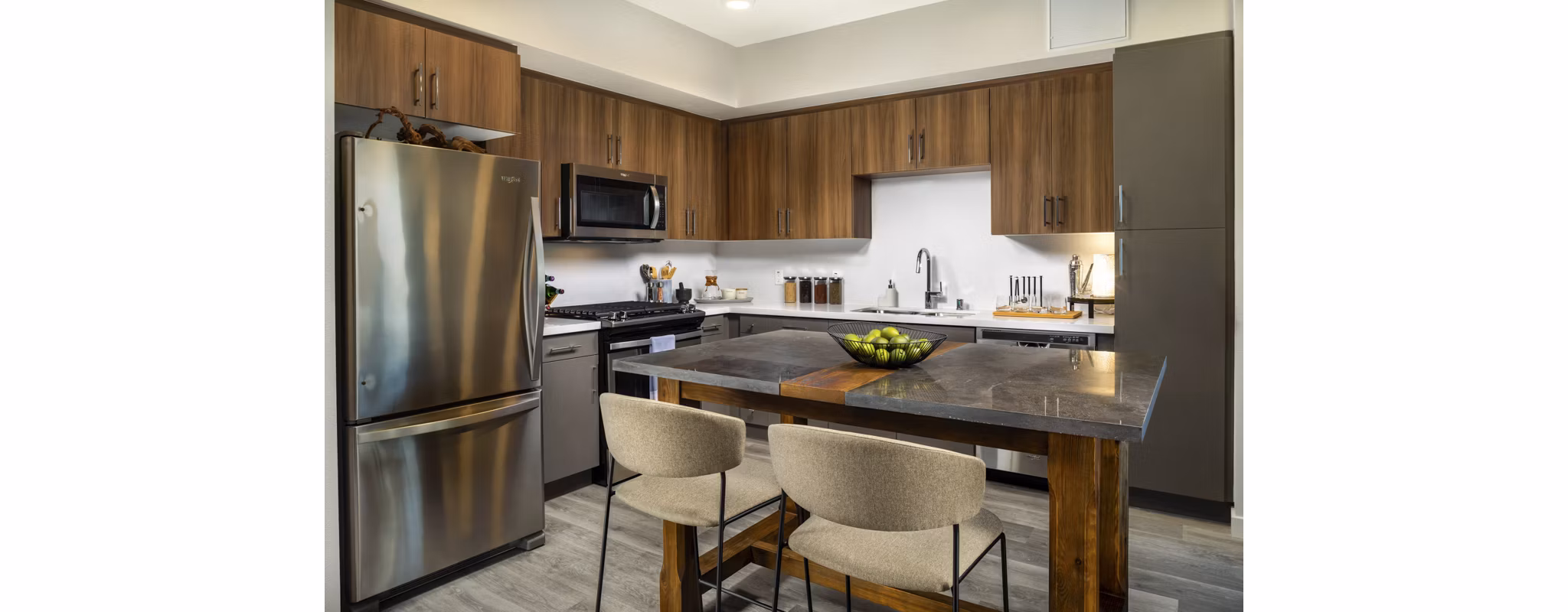 Modern kitchen with stainless steel appliances in Garrison Apartments: Luxury living by Greystar