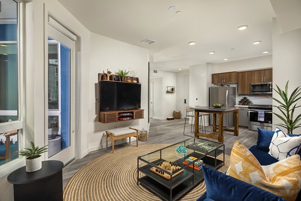 Living room featuring elegant design and natural light at Garrison Apartments, Greystar luxury apartments in an upscale urban setting