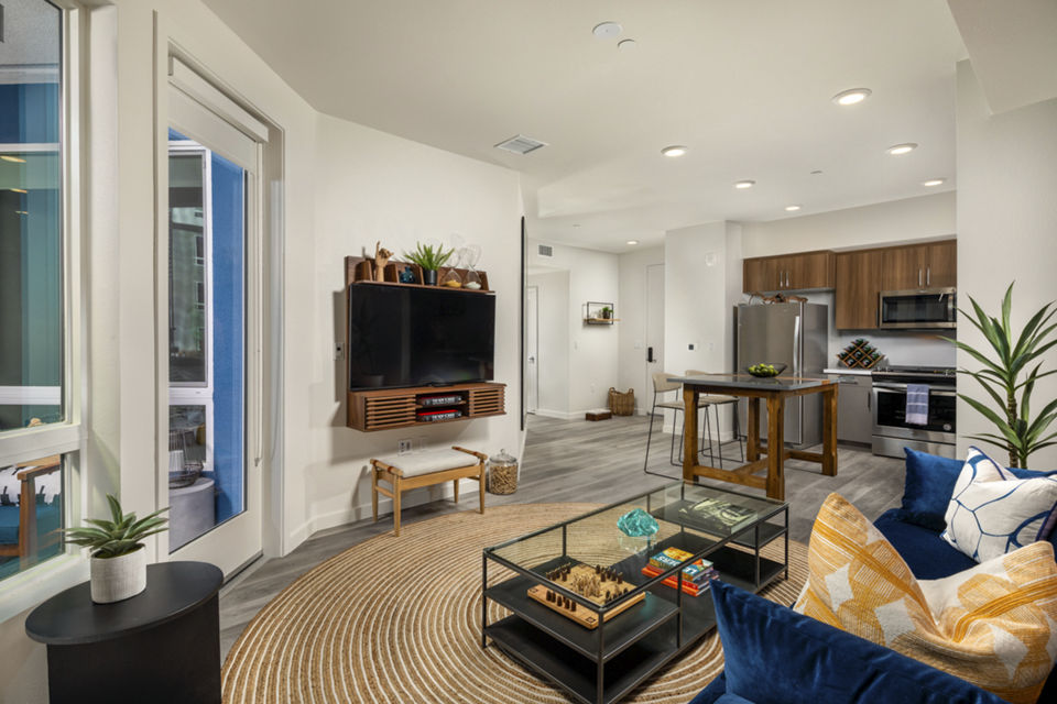 Living room featuring elegant design and natural light at Garrison Apartments, Greystar luxury apartments in an upscale urban setting