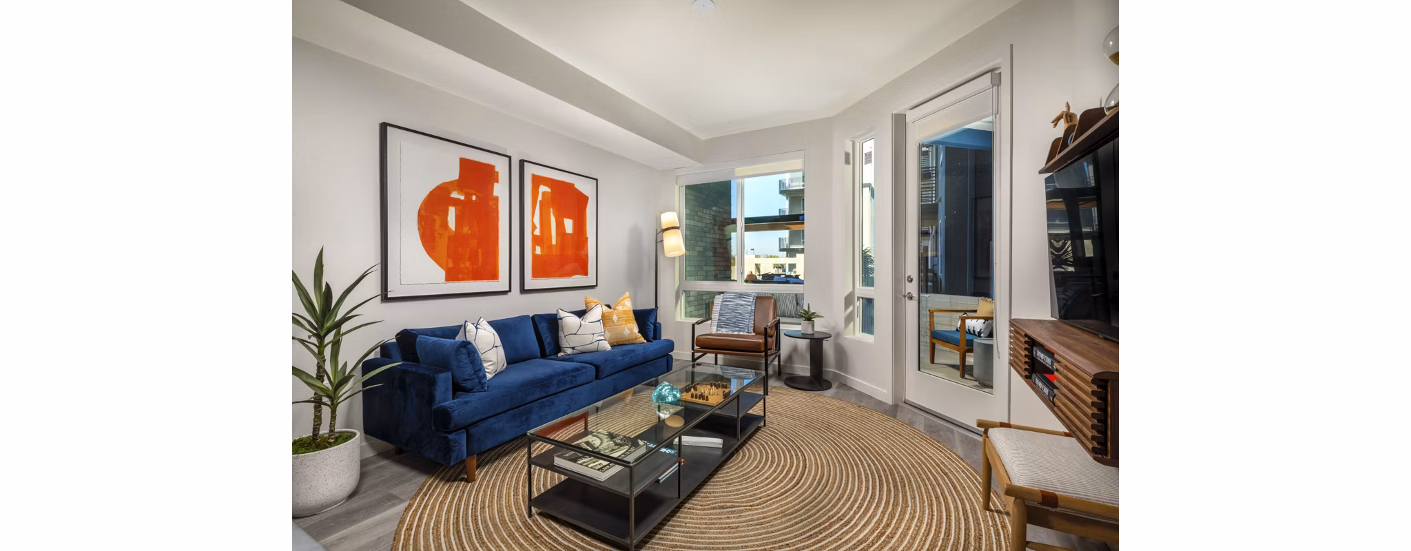 Spacious living room with modern decor and natural light in Garrison Apartments