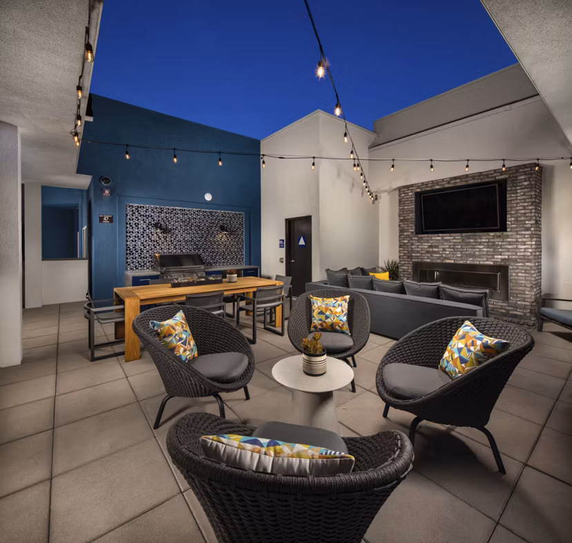 Scenic rooftop deck with seating and skyline views at Garrison Apartments