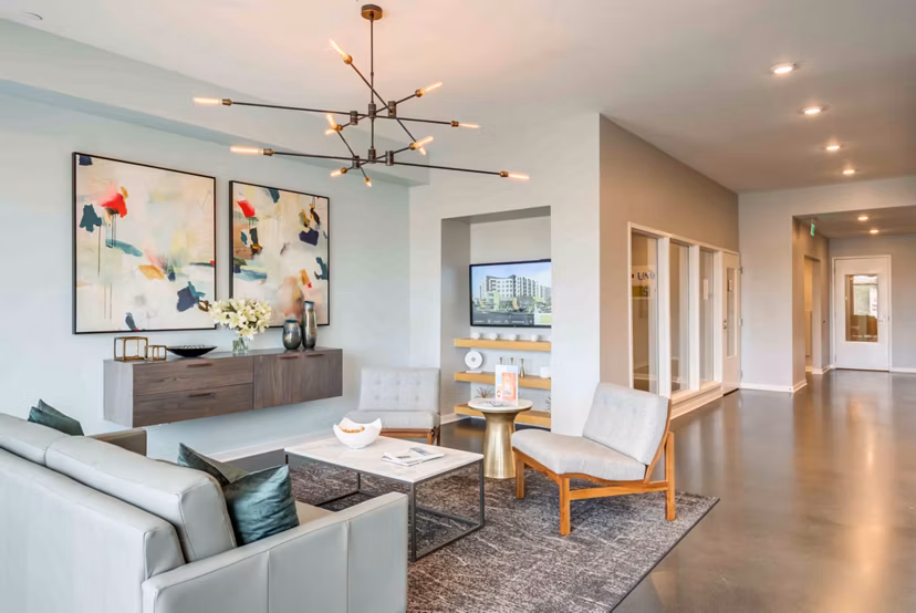 Modern clubhouse with plush seating and game area at Brookside 51 Apartments, ideal for social gatherings and relaxation