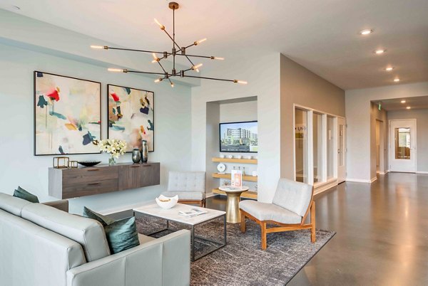 Modern clubhouse with plush seating and game area at Brookside 51 Apartments, ideal for social gatherings and relaxation