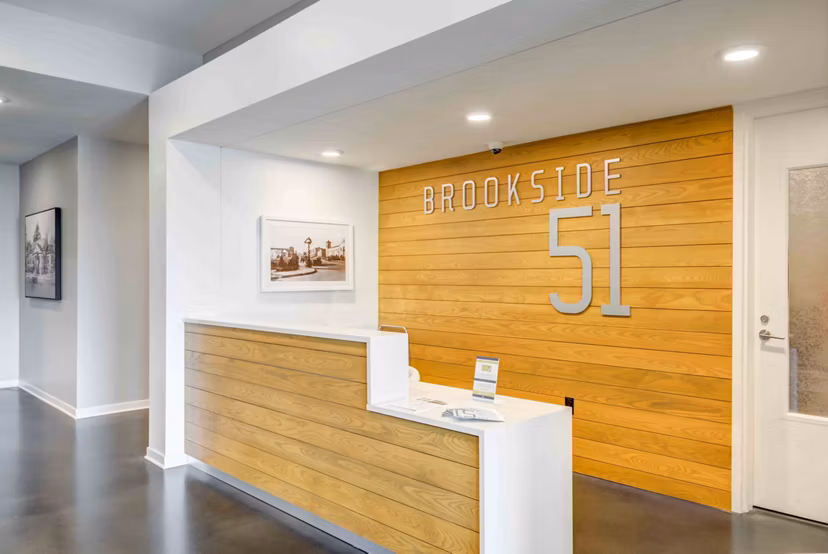 Clubhouse lounge with contemporary seating at Brookside 51 Apartments