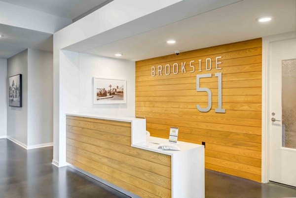 Clubhouse lounge with contemporary seating at Brookside 51 Apartments