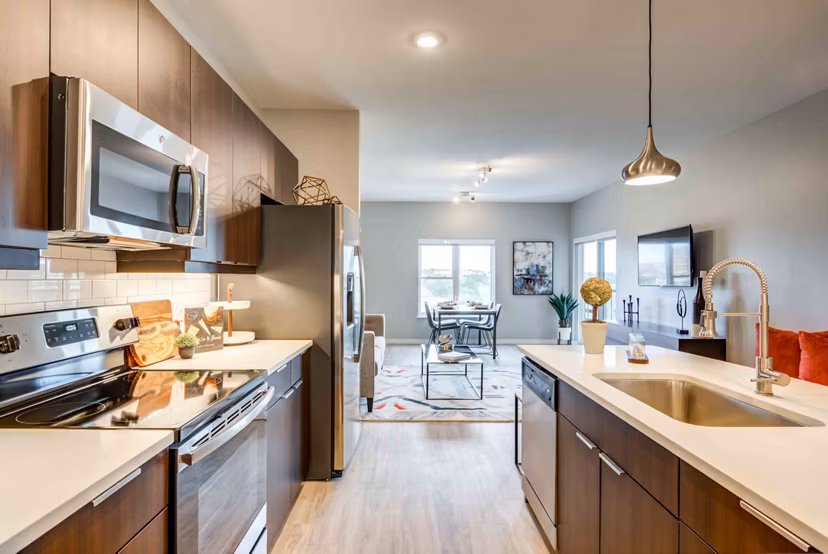 Kitchens with modern appliances and granite countertops in Brookside 51 Apartments, luxury living near Greystar-managed communities