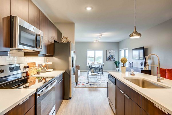 Kitchens with modern appliances and granite countertops in Brookside 51 Apartments, luxury living near Greystar-managed communities