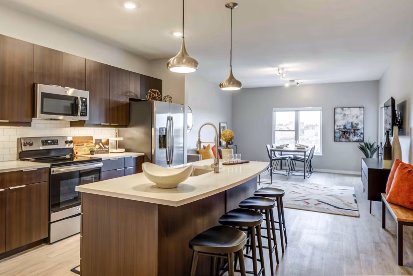 Modern kitchen with stainless steel appliances in Brookside 51 Apartments, luxury living in a vibrant community