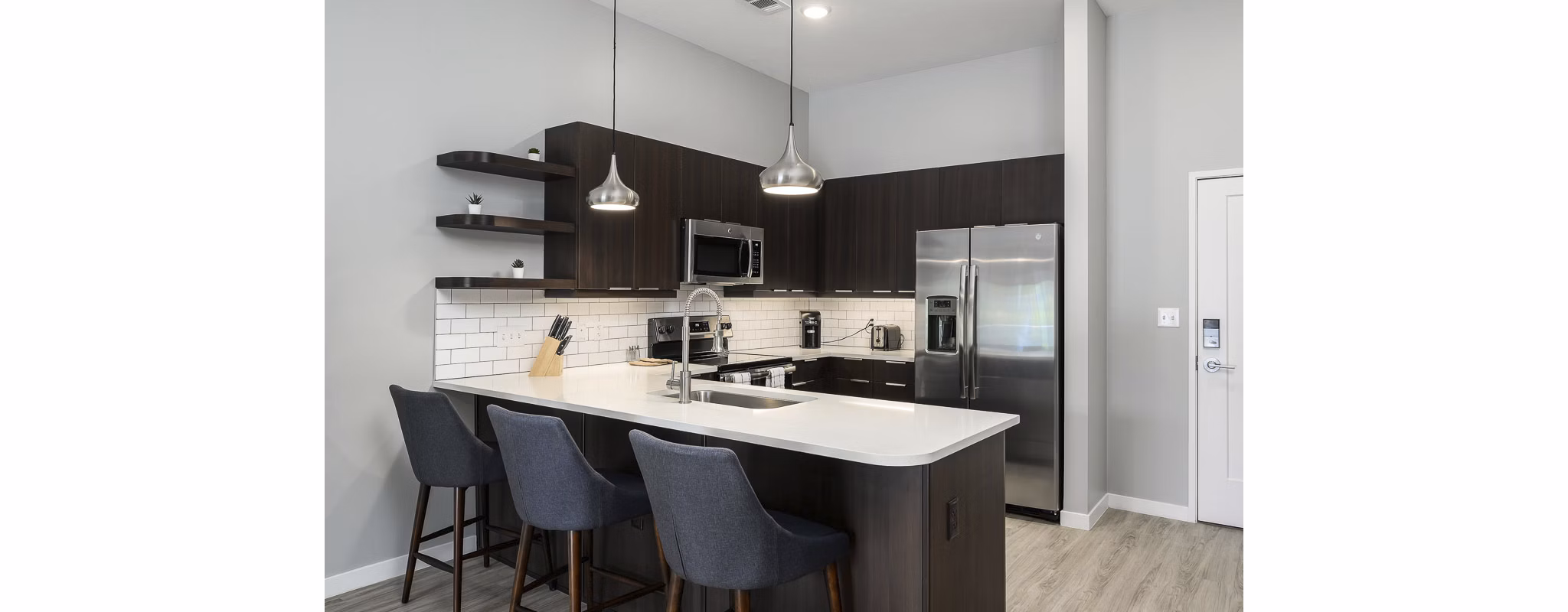 Modern kitchen with stainless steel appliances at Brookside 51 Apartments