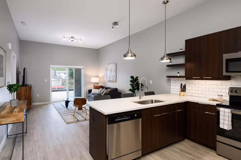 Modern kitchen with stainless steel appliances at Brookside 51 Apartments