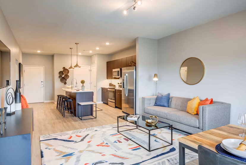 Living room with modern furnishings and abundant natural light at Brookside 51 Apartments