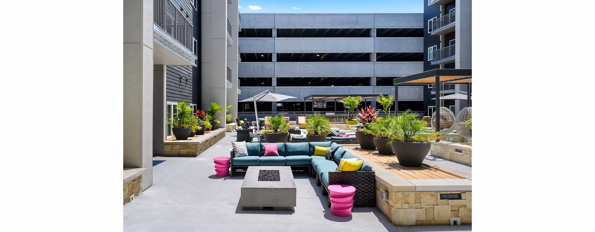 Outdoor fire pit with cozy seating area at Brookside 51 Apartments, perfect for gatherings and relaxation in a luxurious setting