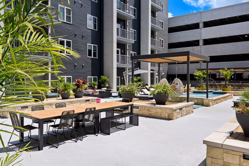 Serene courtyard with lush greenery at Brookside 51 Apartments, a luxury community offering modern living spaces and exclusive amenities