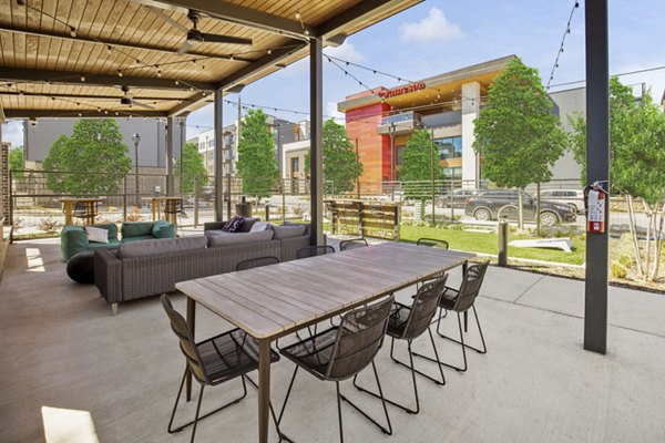 Cozy outdoor patio space with stylish seating at The Jameson at the Bluffs Apartments, perfect for relaxation and gatherings