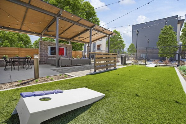 Courtyard with landscaped gardens and seating areas at The Jameson at the Bluffs Apartments