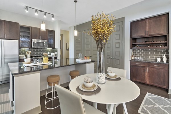 Dining area with modern furnishings at Circuit Apartments, luxury living spaces by Greystar in a vibrant urban setting