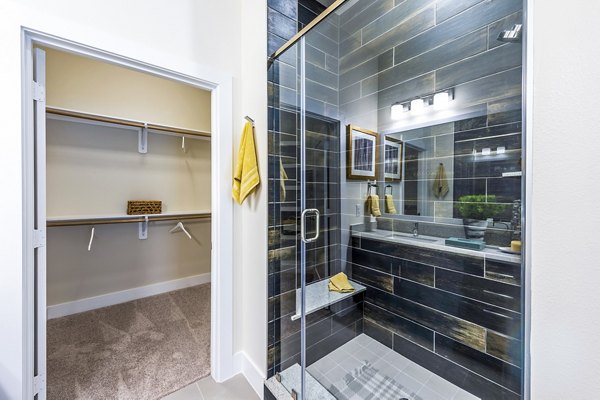 Bathroom featuring modern fixtures and sleek design at Foundry on 19th Apartments