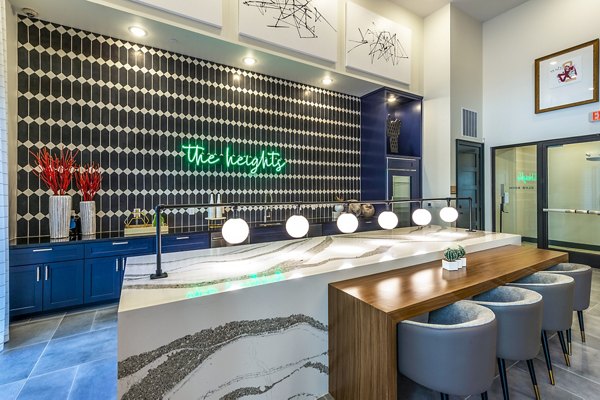 Elegant clubhouse lobby with modern decor at Foundry on 19th Apartments, featuring cozy seating areas and a welcoming atmosphere