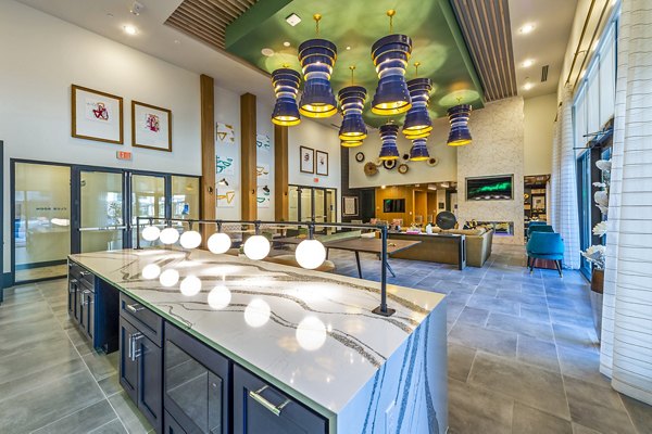 Modern clubhouse lobby featuring stylish seating and lighting at Foundry on 19th Apartments