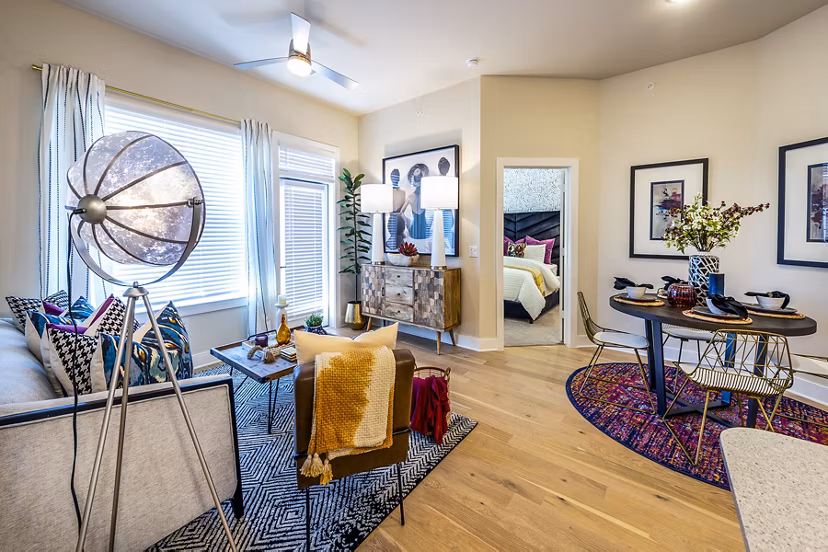 Dining area featuring modern decor and large windows in Foundry on 19th Apartments, offering luxury living spaces in a prime location