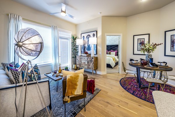 Dining area featuring modern decor and large windows in Foundry on 19th Apartments, offering luxury living spaces in a prime location