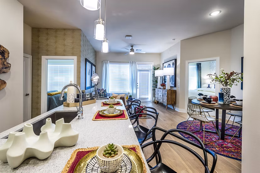 Dining room with modern decor and elegant lighting at Foundry on 19th Apartments