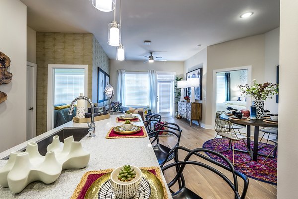 Dining room with modern decor and elegant lighting at Foundry on 19th Apartments