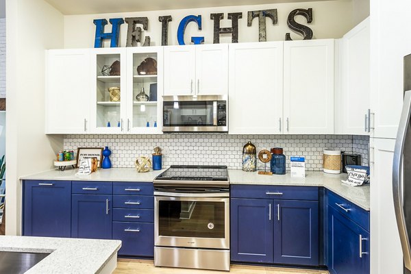 Modern kitchen with stainless steel appliances in Foundry on 19th Apartments