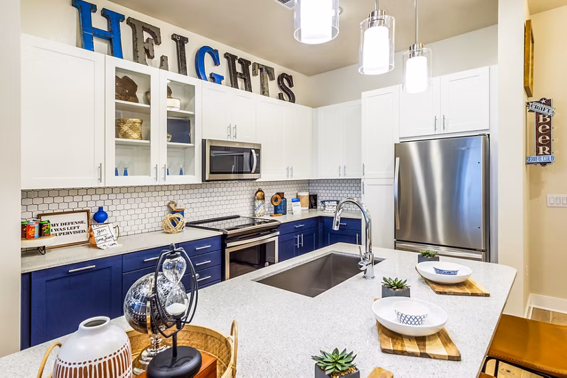 Modern kitchen featuring sleek cabinetry and stainless appliances in Foundry on 19th Apartments